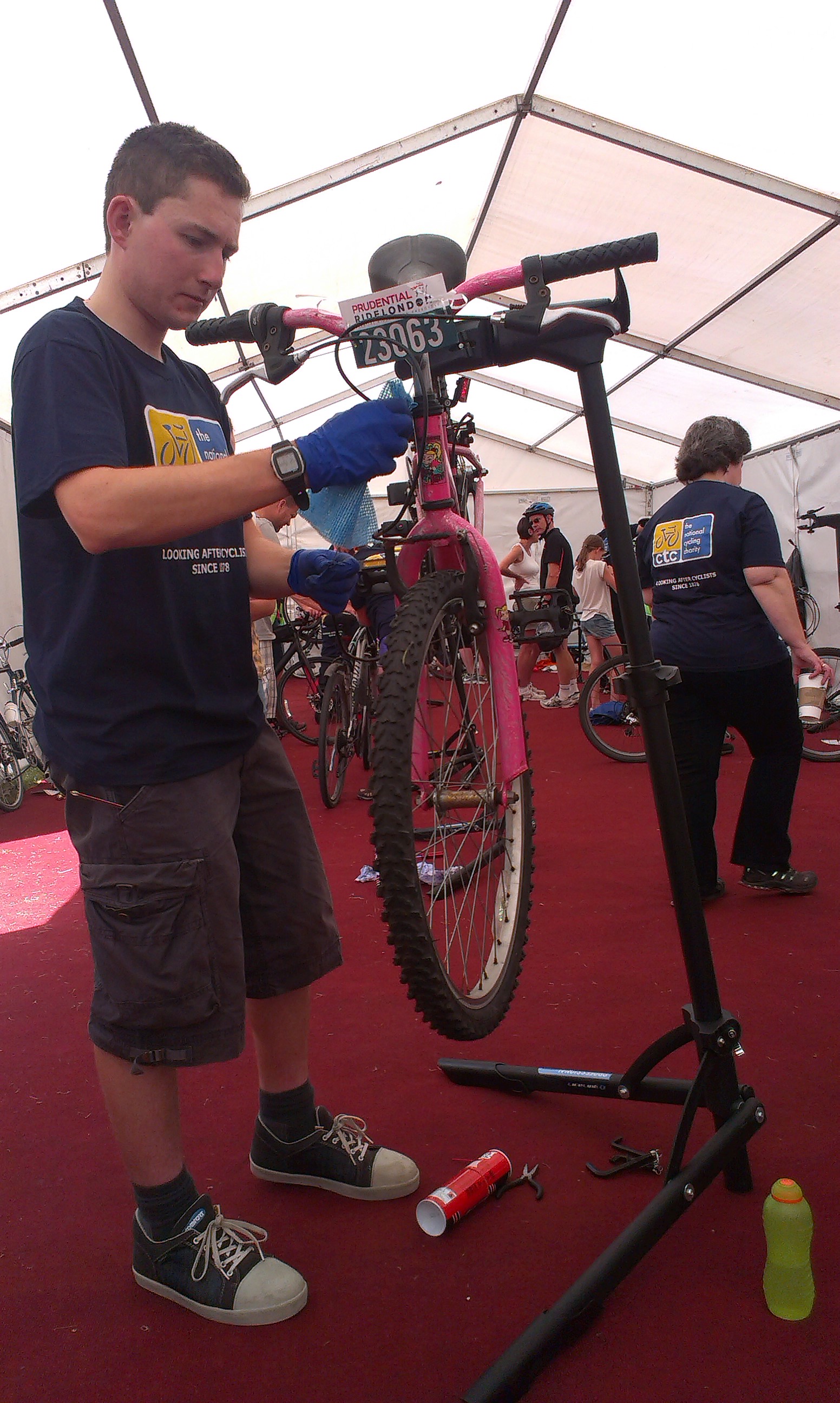 Another Dr Bike volunteer fixing a Freecycle bike