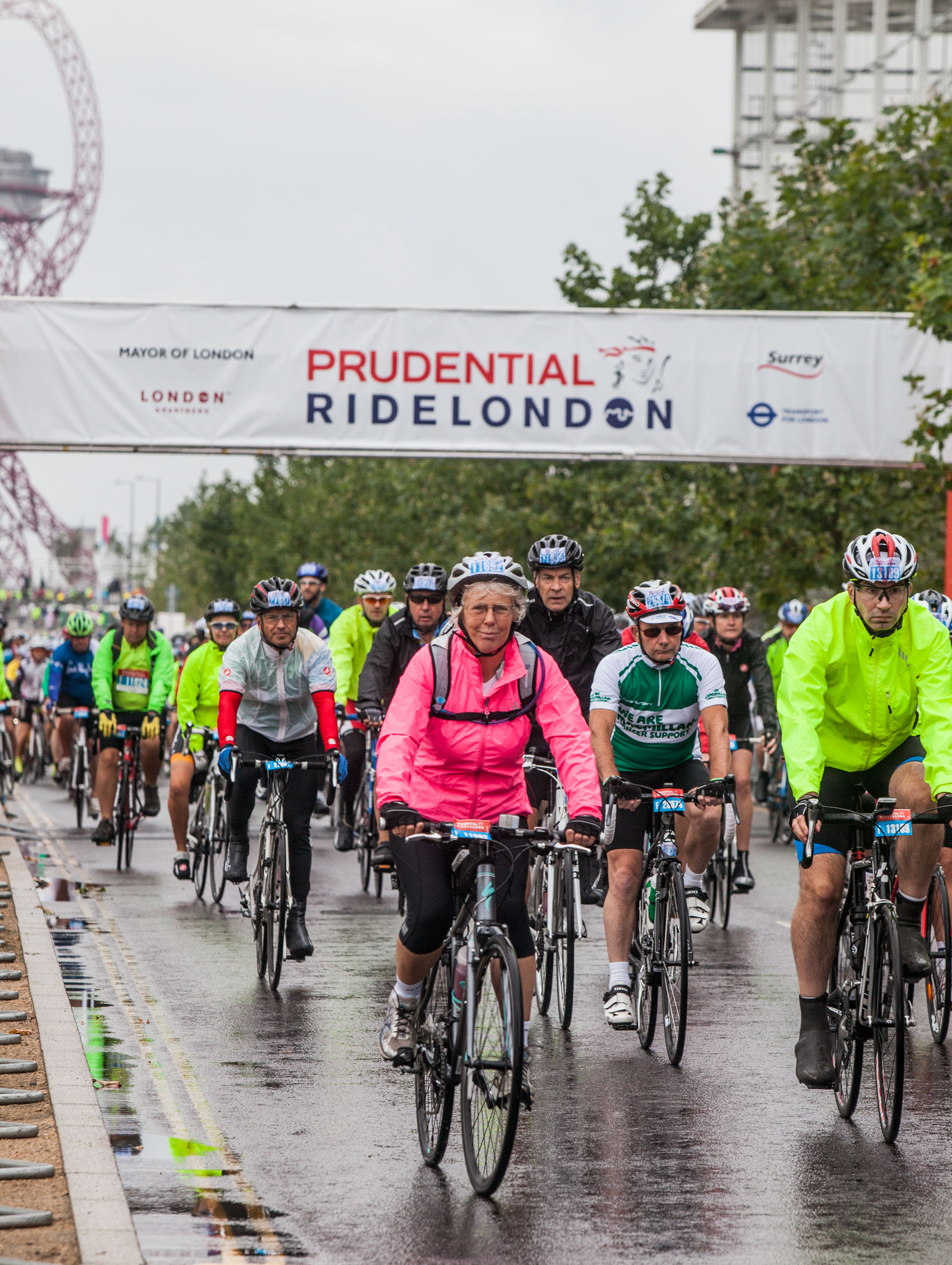 Cyclists under the RideLondon 2014 banner