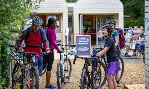 Cyclists parking their bikes outside a Café